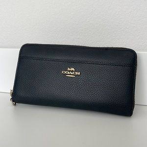 Black Leather Coach Long Wallet with Gold Zipper Details. Wristlet strap missing